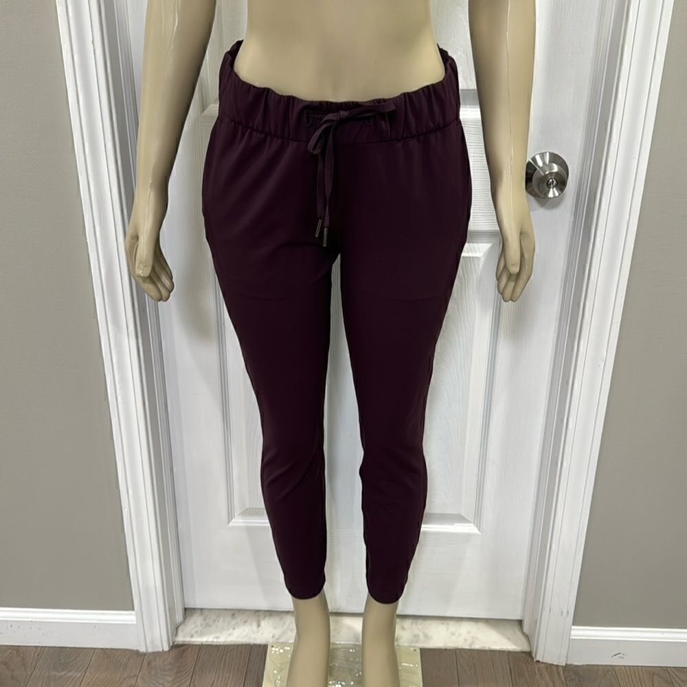 LULULEMON ON THE FLY DRAWSTRING PANTS. BLACK CHERRY